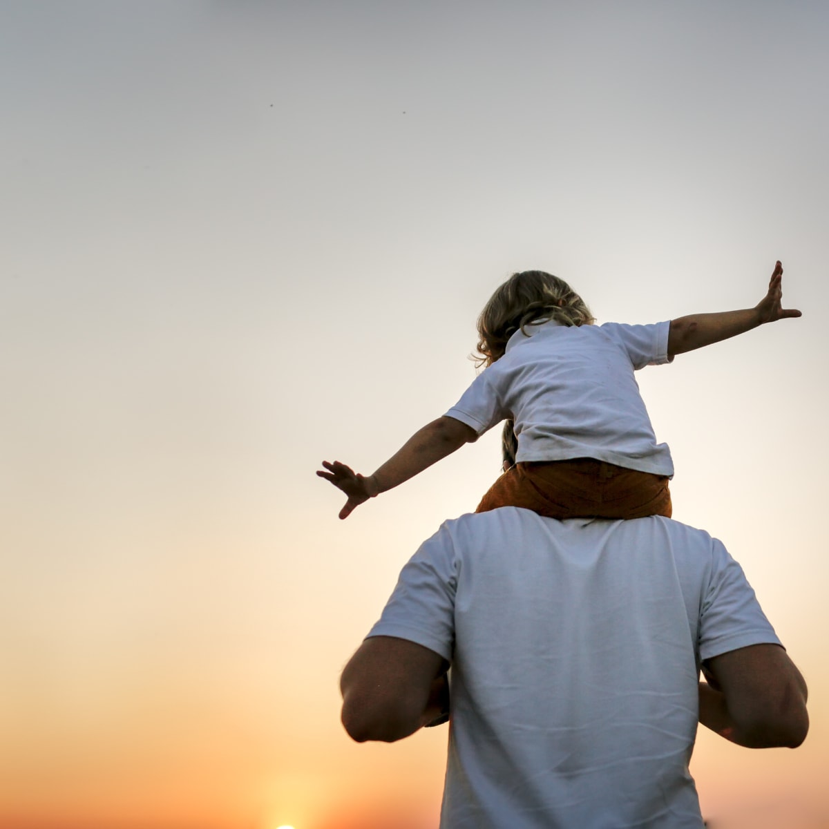 Father and son in the sunset