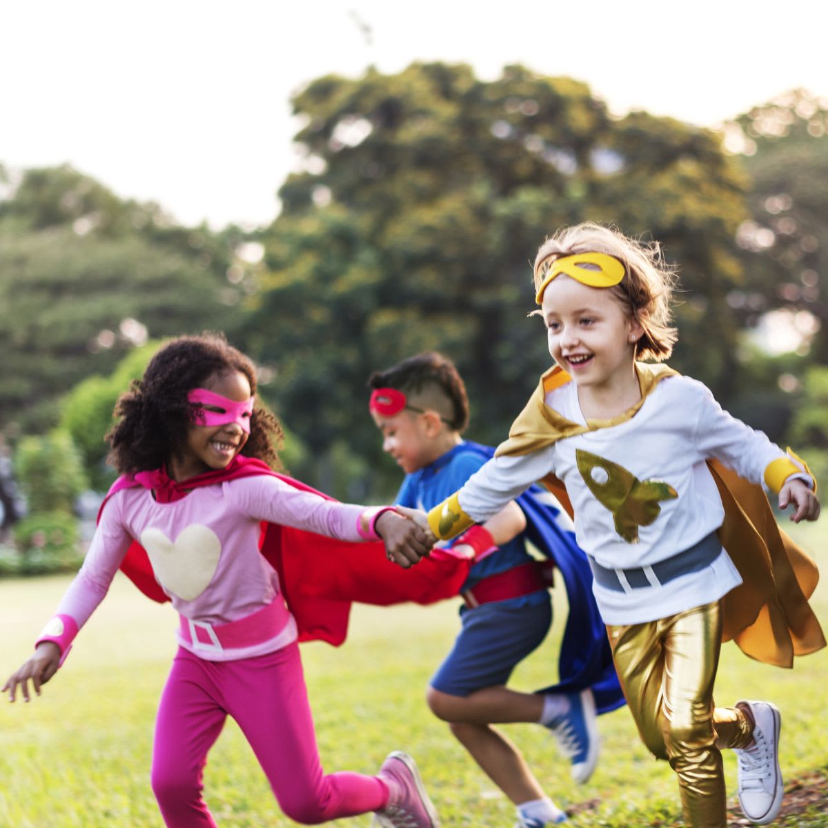 Kids running in super hero costume