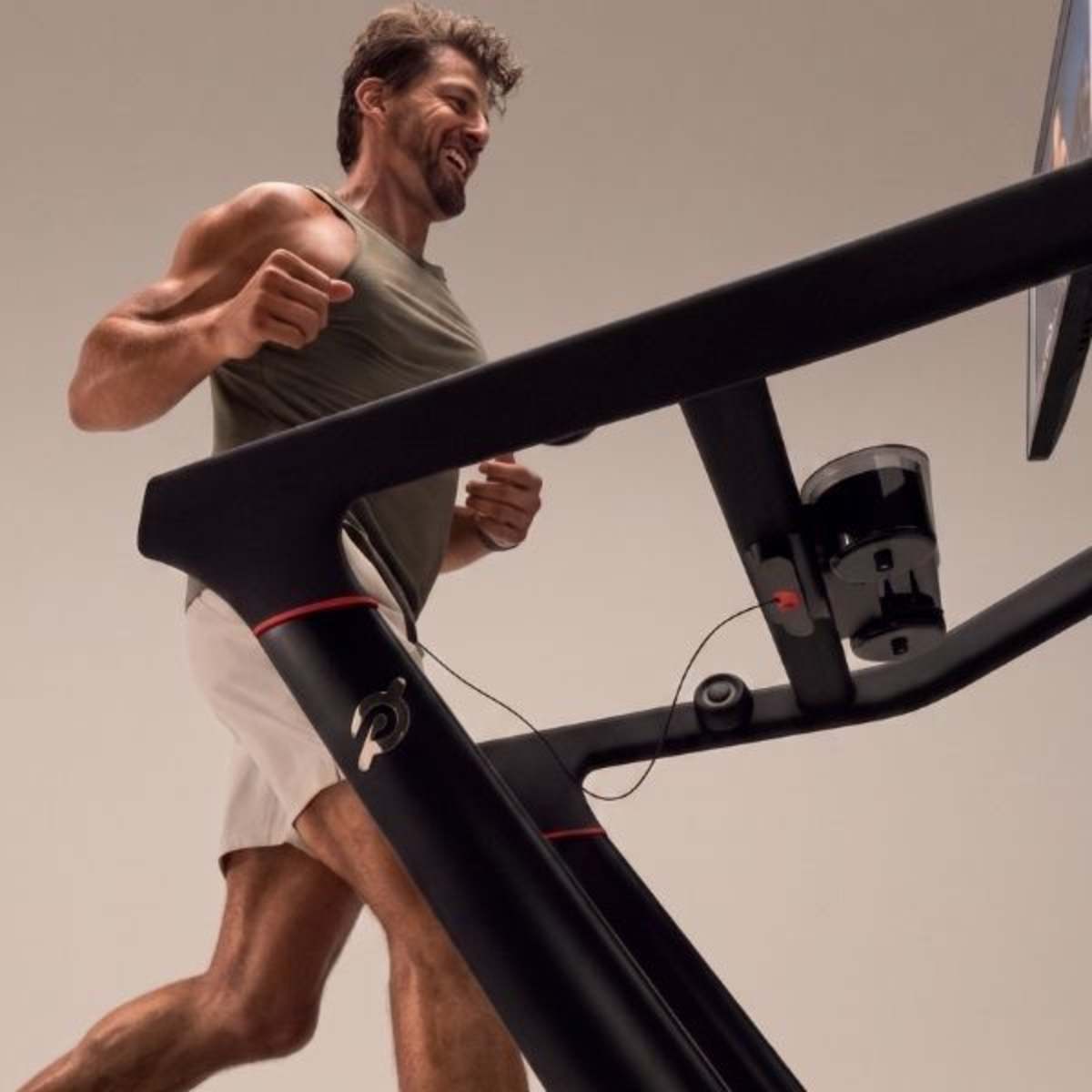 man, elated, running on peloton treadmill
