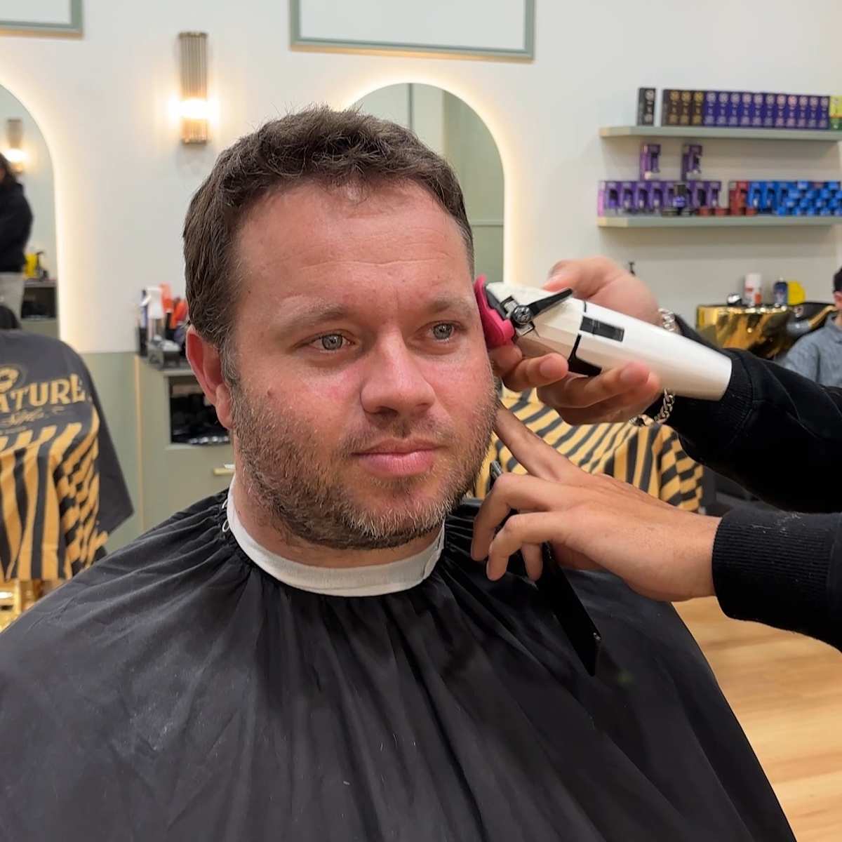Picture of man having a hair cut. 