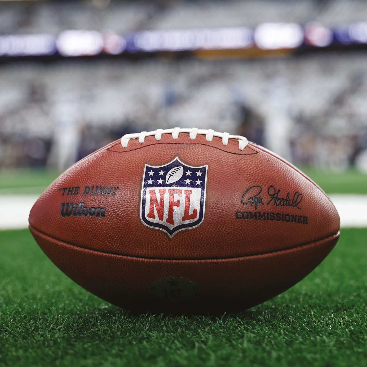 NFL ball on a pitch