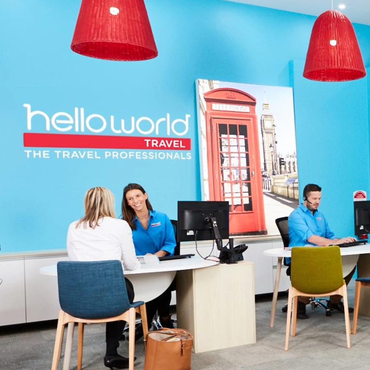 Picture of travel agent sitting with a customer.