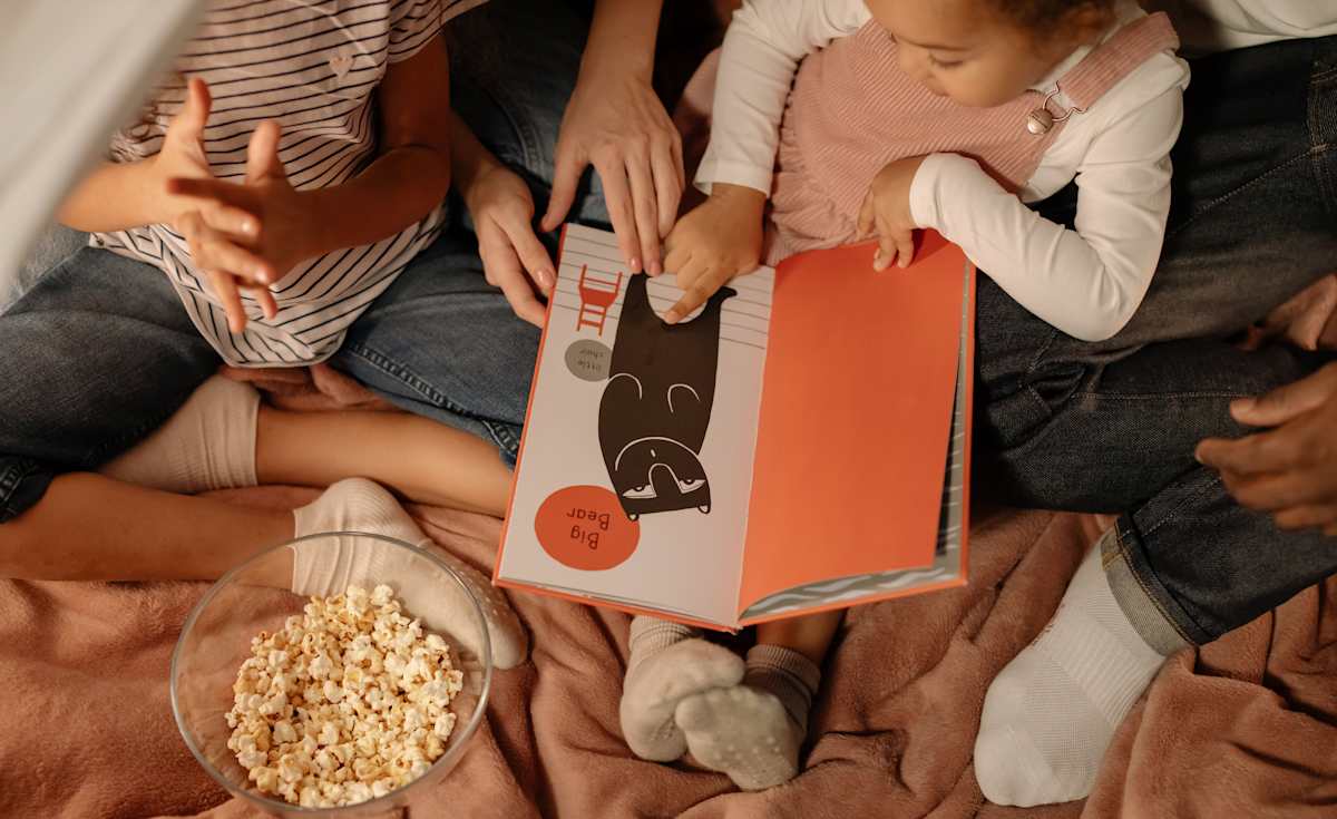 Family reading book together