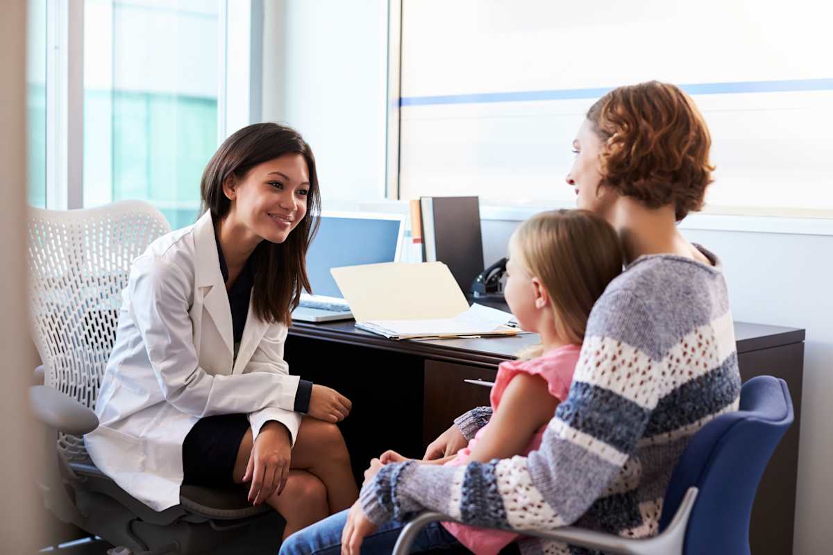 Mother and daughter having a consultation with a doctor, nutritionist. 