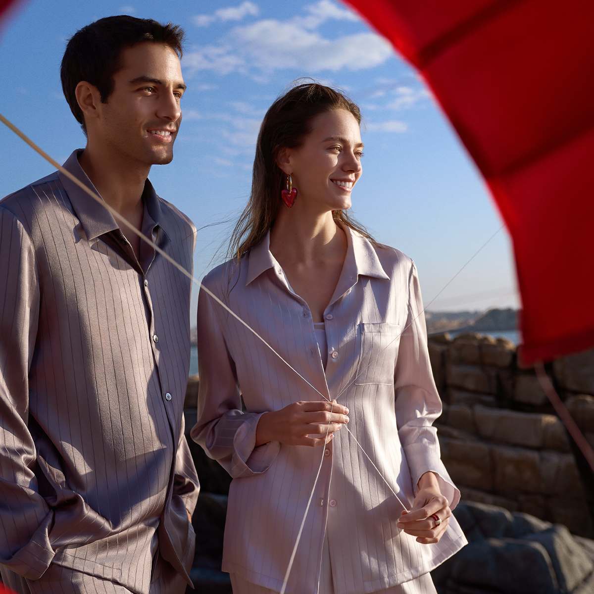 A man and lady staring into the distance 