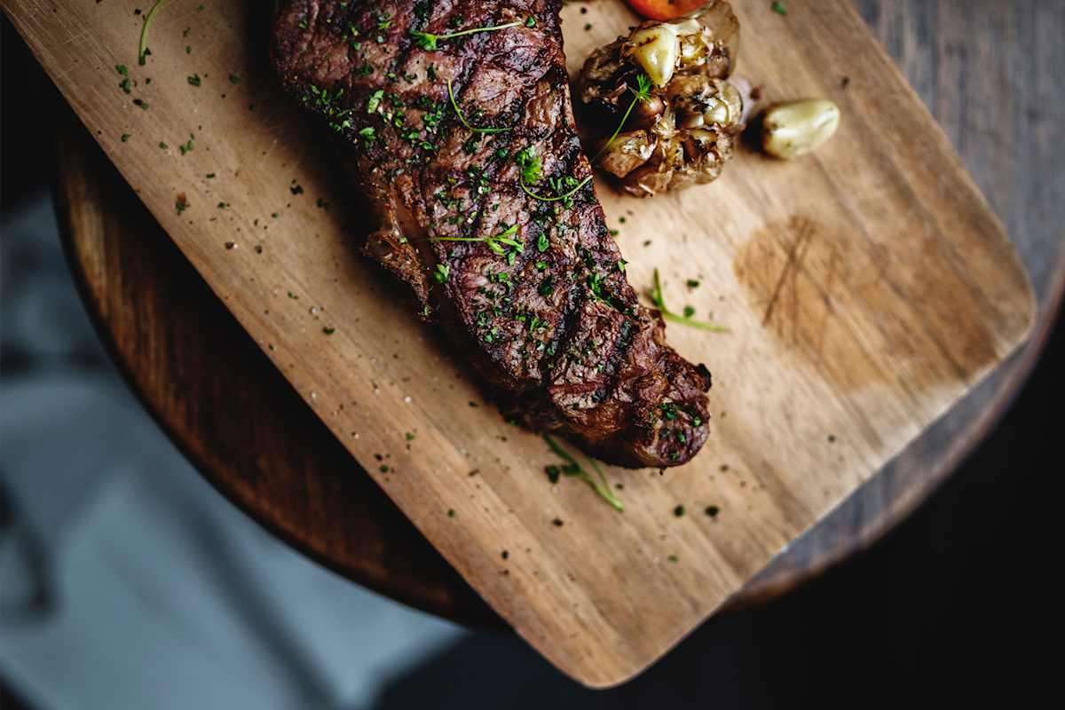 Cooked steak on a chopping board 
