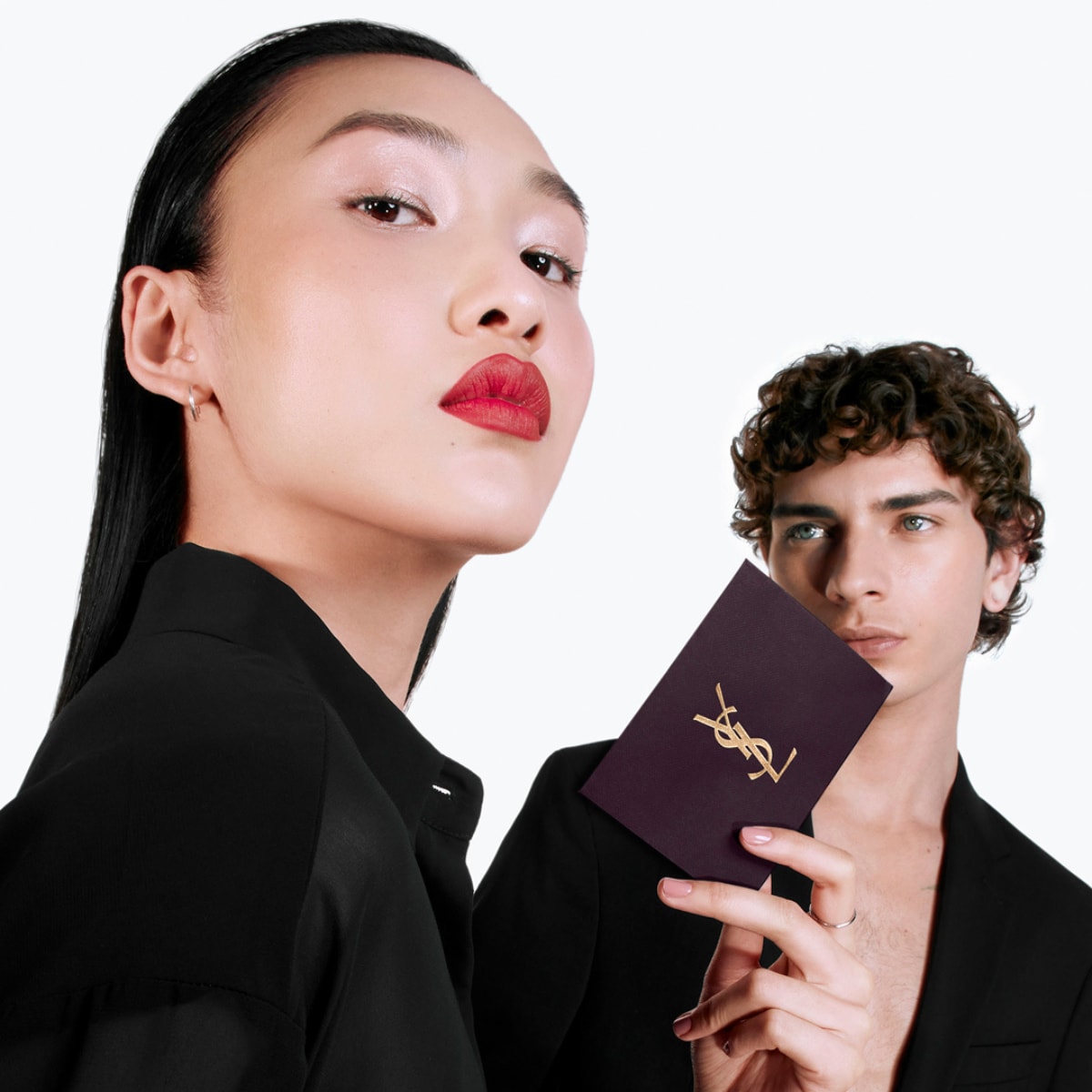 Picture of lady with red lips and makeup and man in the background