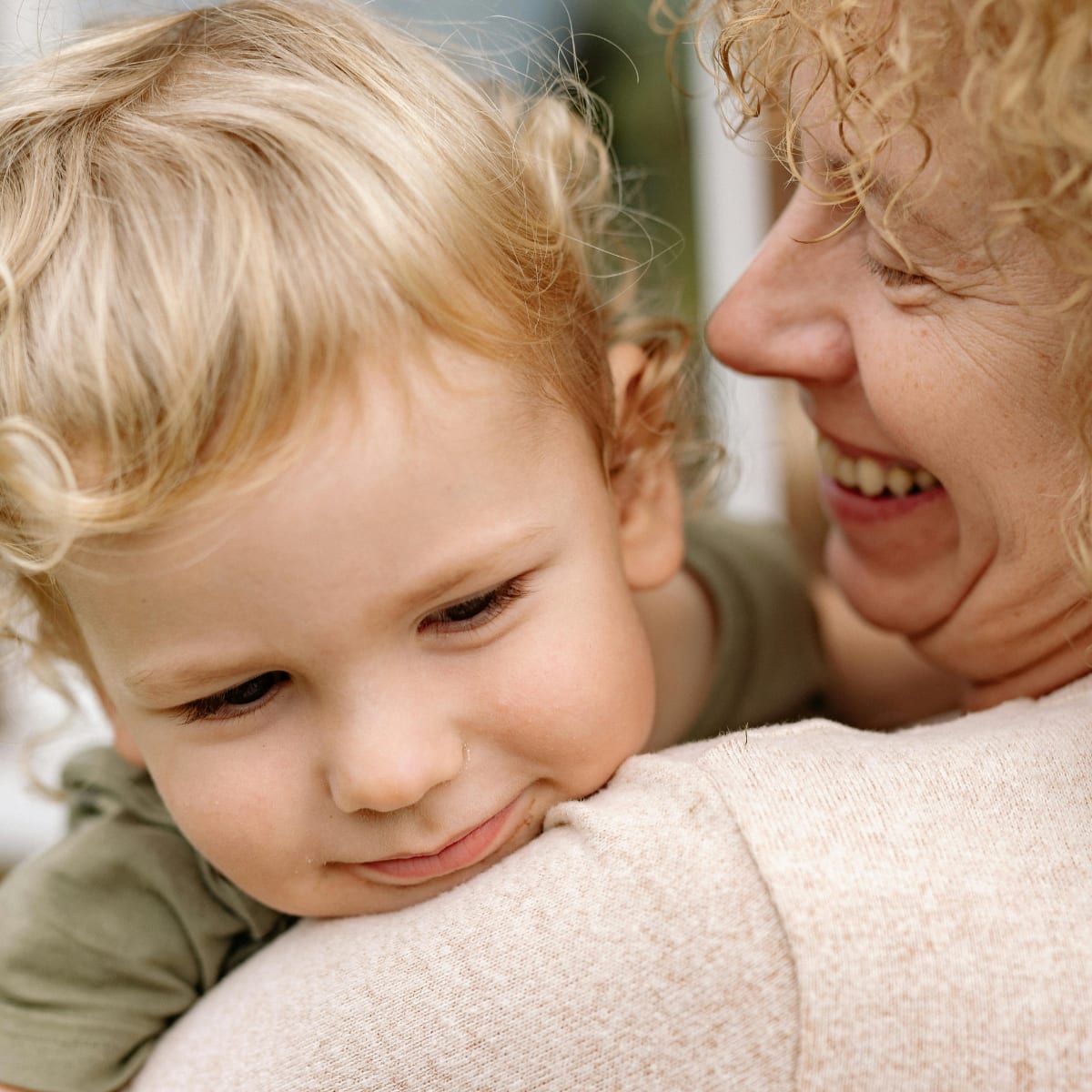 A picture of a lady holding a child 
