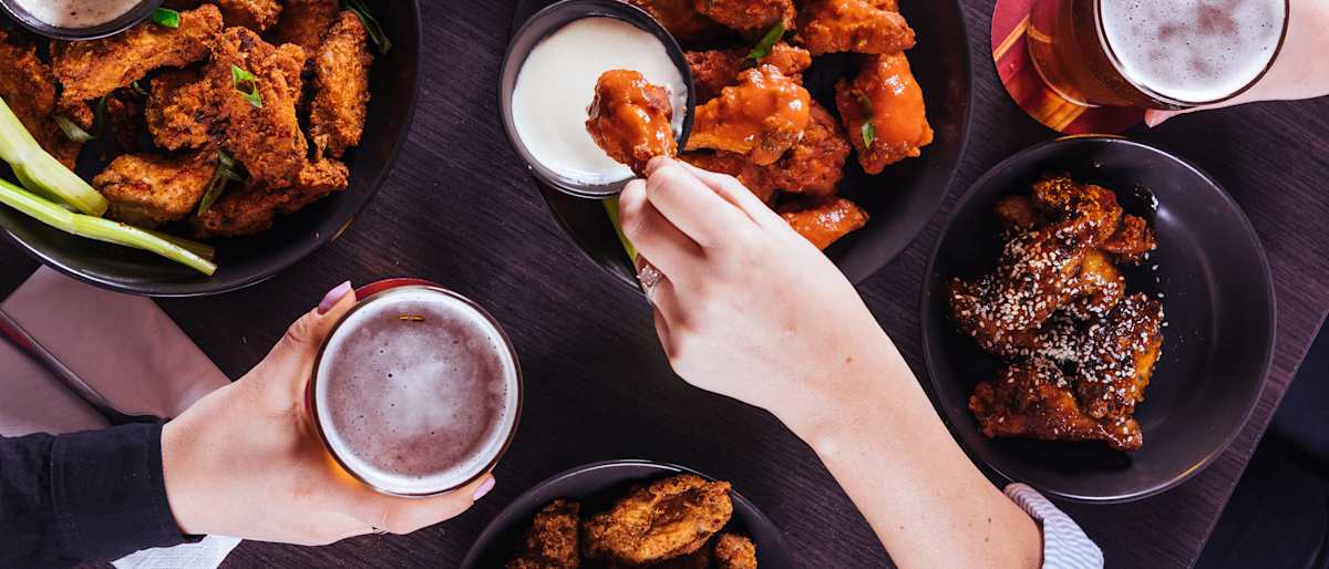 Wings and beer flat lay