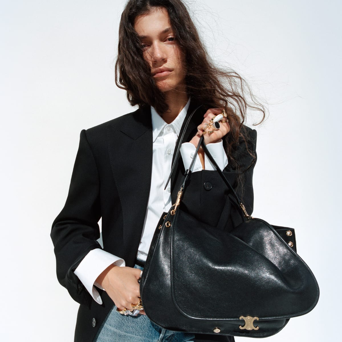 A model wearing CELINE clothing and accessories.