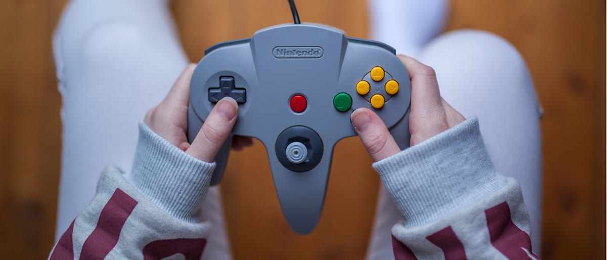 person playing with a nintendo game controller