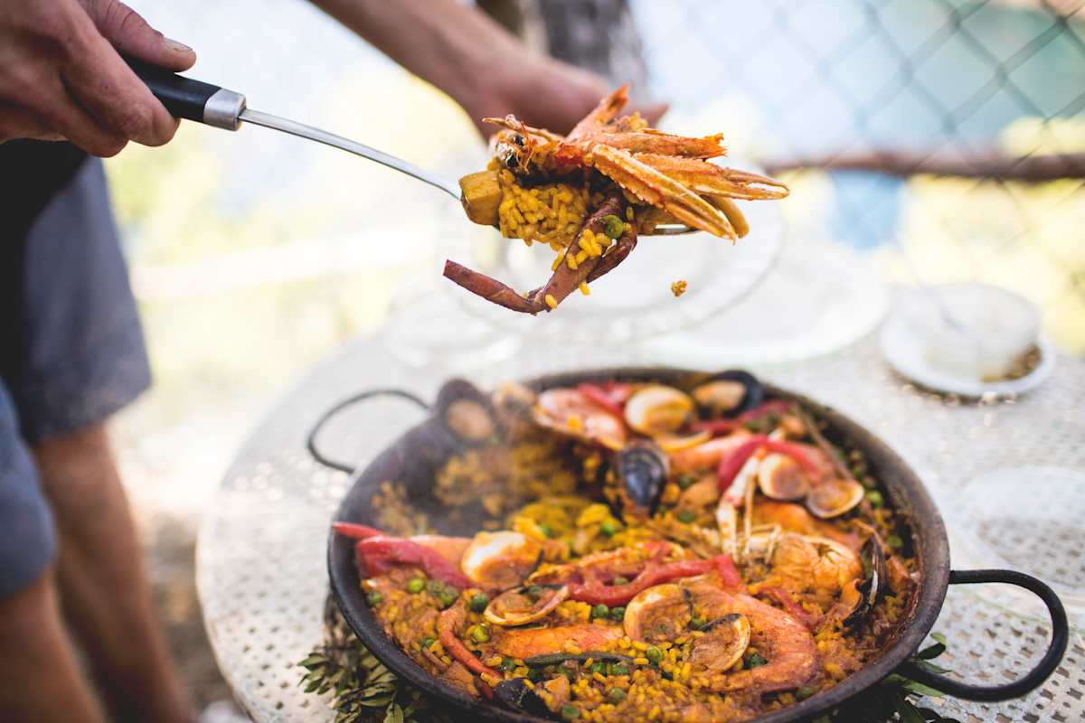 Cooking seafood paella on a hot plate.