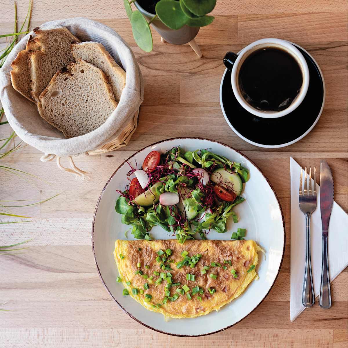 An image of breakfast food and coffee