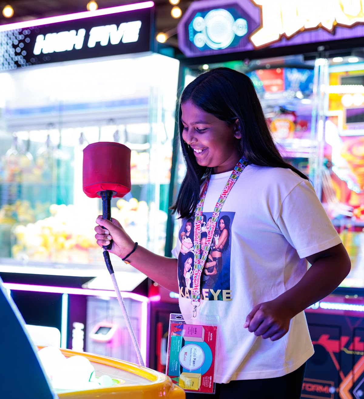 An image of a girl at iPlay with a Kids Pass. 
