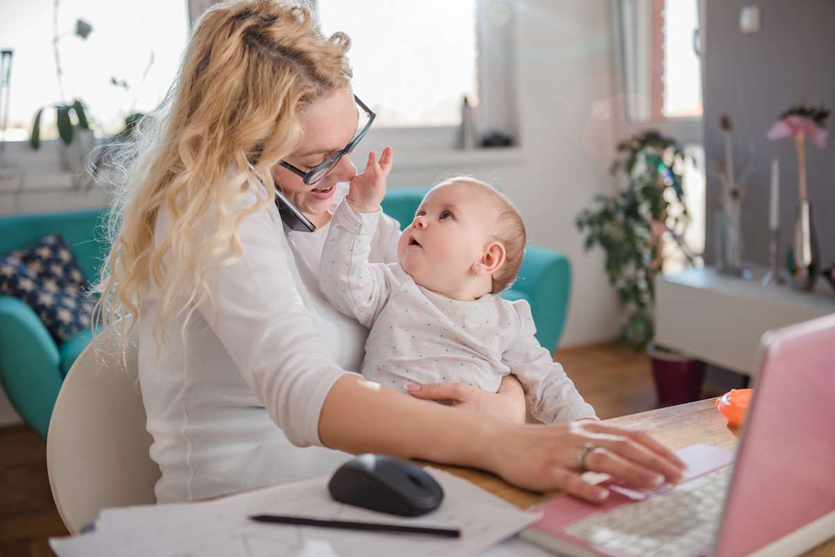 Mum playing with a baby