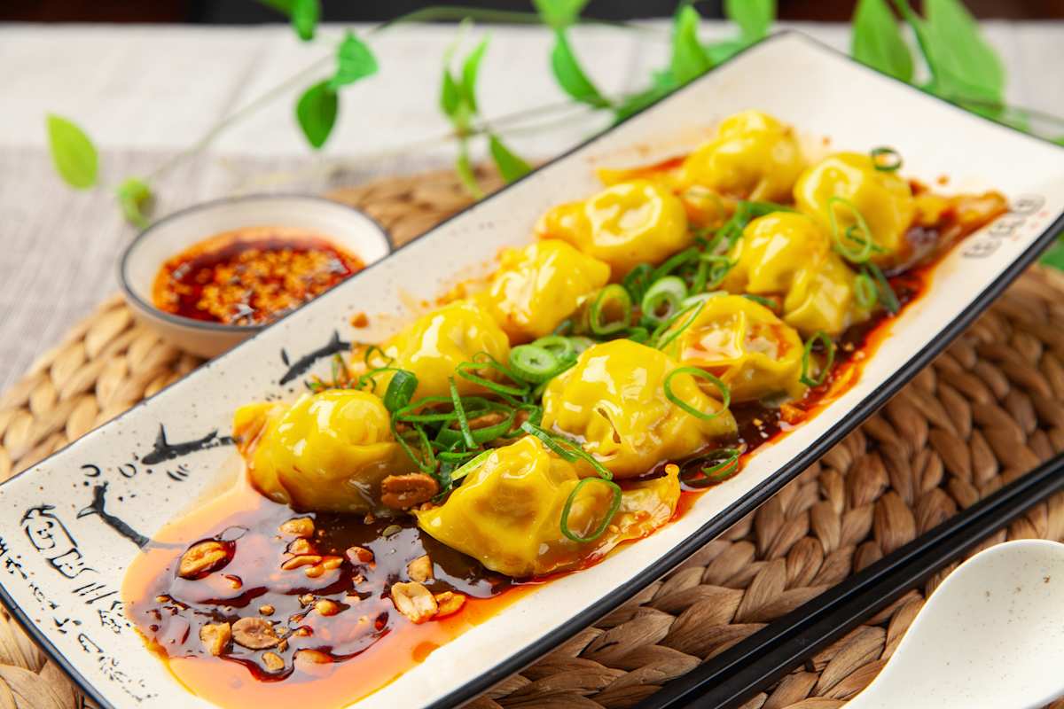 Little Bao pork prawn dumplings in mild spicy sauce