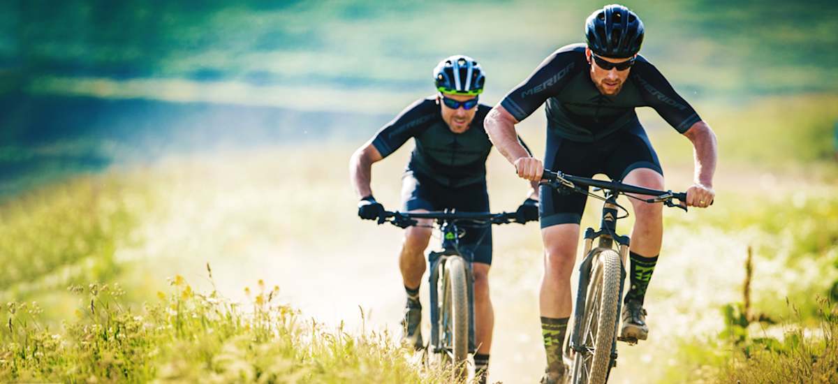 Two men riding mountain bikes
