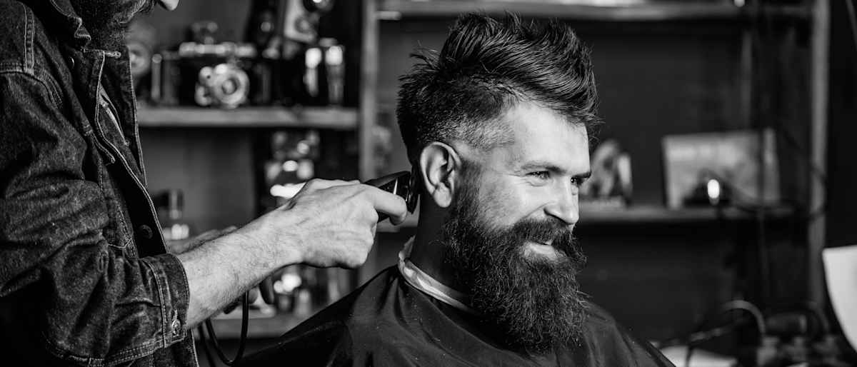 Man getting his hair cut at a barber