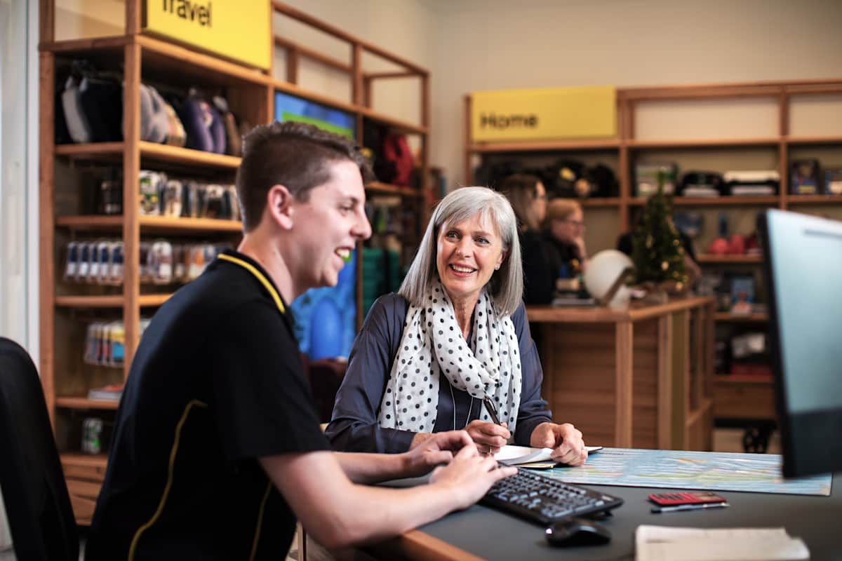Two people sit in RAA store 2020