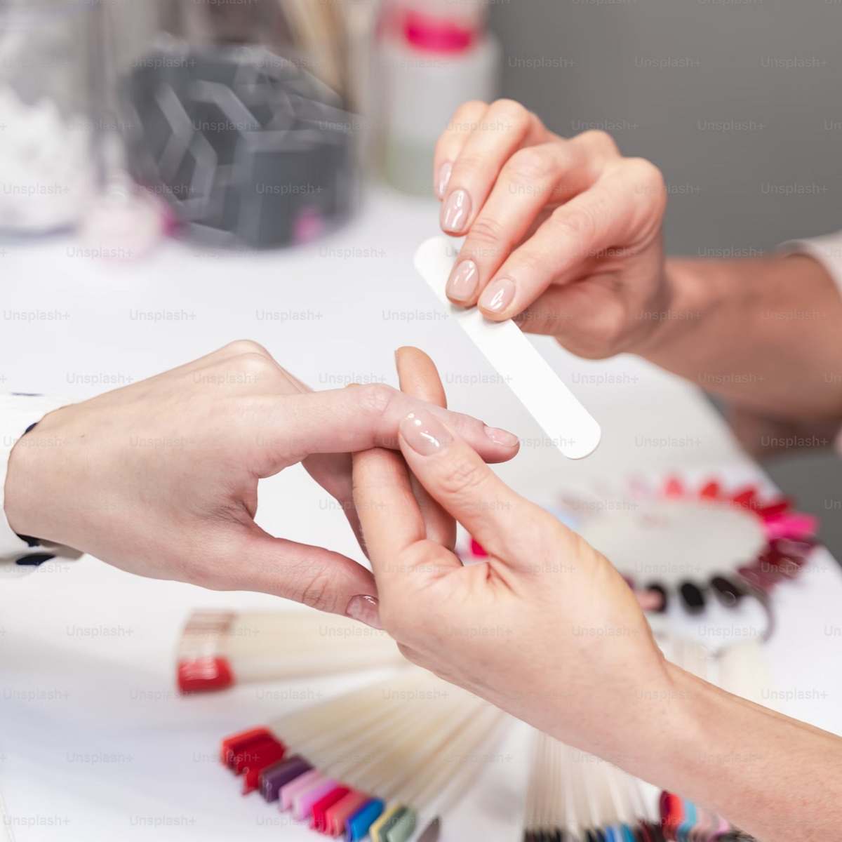 women makes nail.jpg