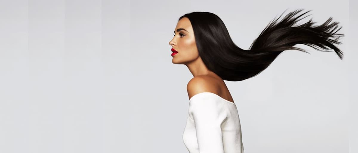 Hairhouse Warehouse model with long dark styled hair 