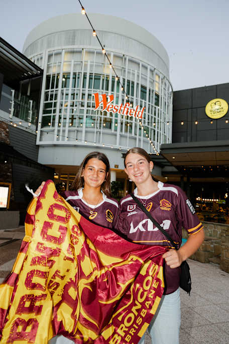 Two girls holDing Brisbane Broncos merch at Westfield