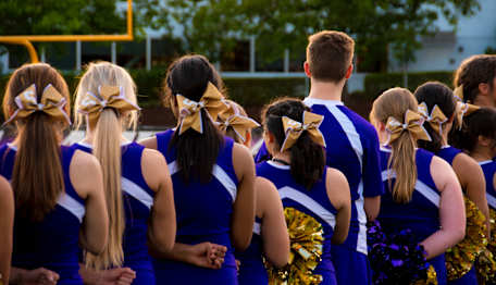 Stock image from Bynder of cheer team