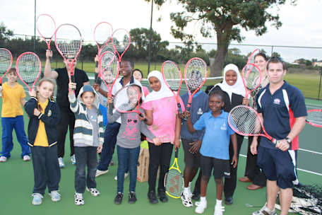 Group of children with their tennis rackets