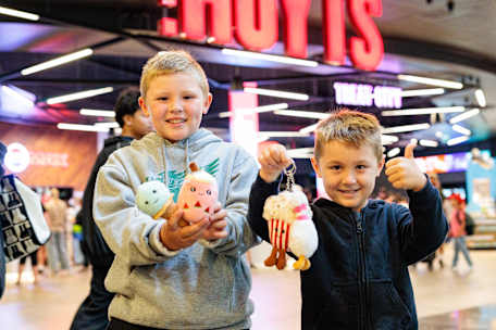 An image of children holding plushies.