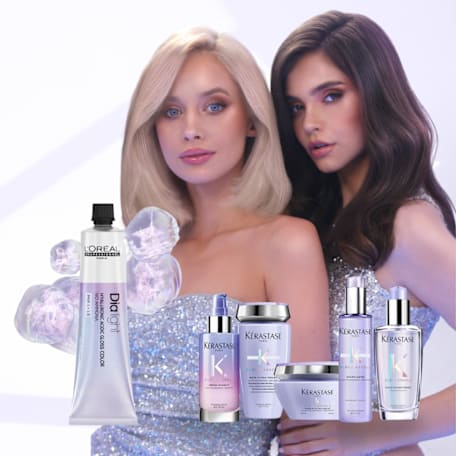Two women posing with kerastase product.